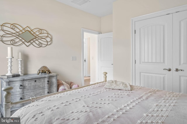 unfurnished bedroom featuring a closet and hardwood / wood-style floors