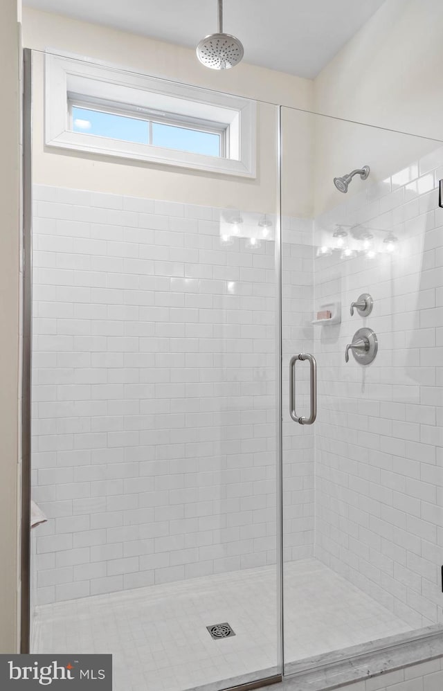 bathroom featuring an enclosed shower