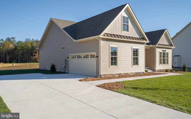 view of front facade with a front yard and a garage