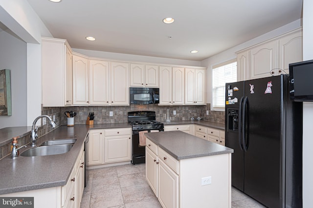 kitchen featuring tasteful backsplash, a kitchen island, light tile floors, sink, and black appliances