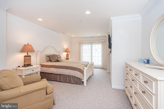 bedroom with crown molding and light colored carpet