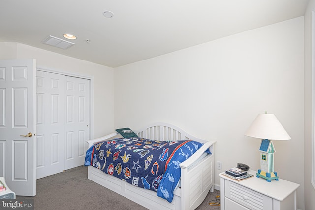 carpeted bedroom with a closet