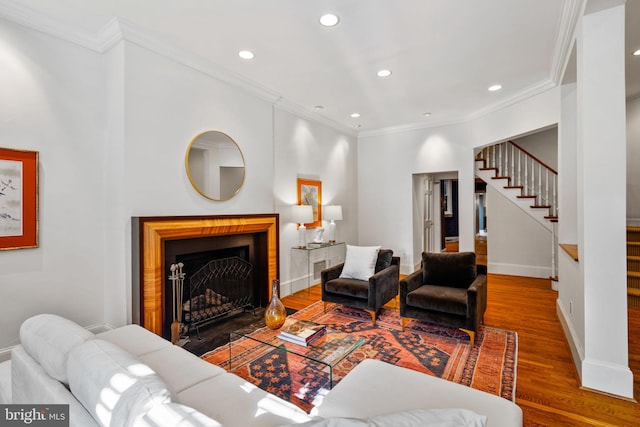 living room featuring ornamental molding and dark hardwood / wood-style floors