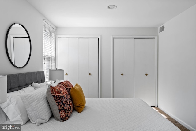 bedroom featuring multiple closets