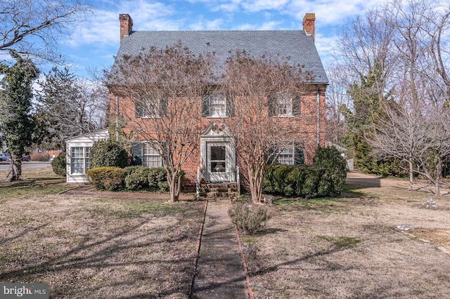 rear view of house with a yard