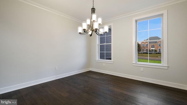 unfurnished room with an inviting chandelier, ornamental molding, dark hardwood / wood-style floors, and a wealth of natural light