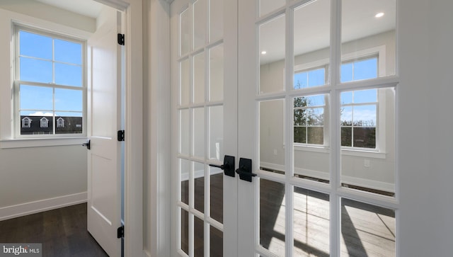 room details with hardwood / wood-style floors and french doors