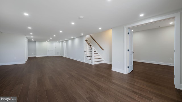 basement featuring dark hardwood / wood-style flooring