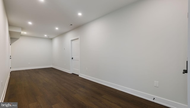 unfurnished room featuring dark hardwood / wood-style floors