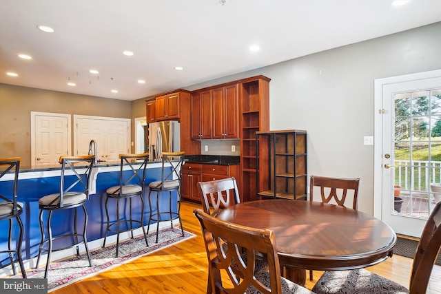 dining room with light wood-type flooring