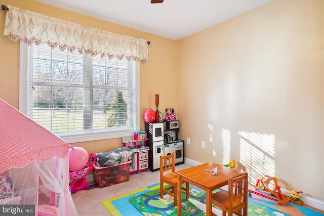 playroom featuring light colored carpet