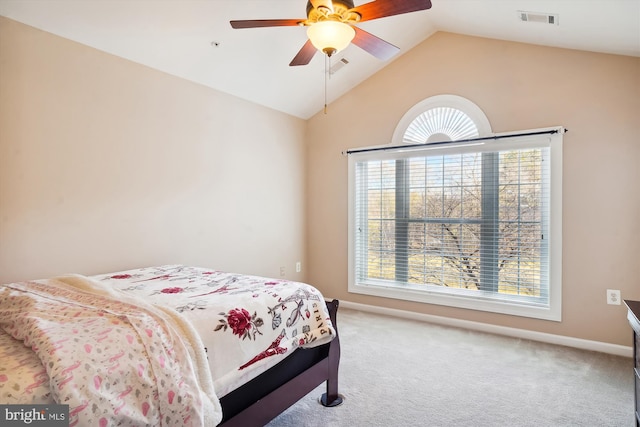 bedroom with lofted ceiling, ceiling fan, light carpet, and multiple windows