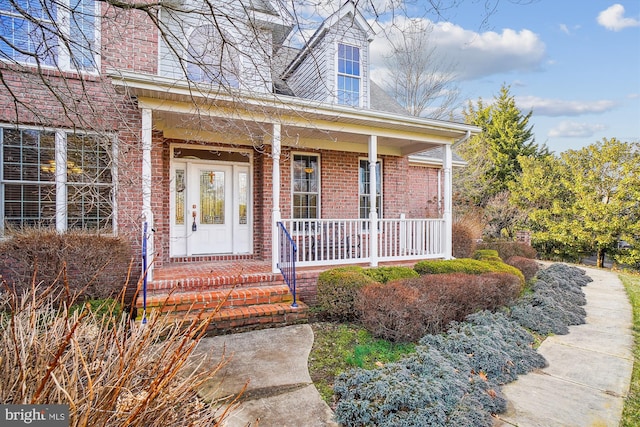 entrance to property with a porch