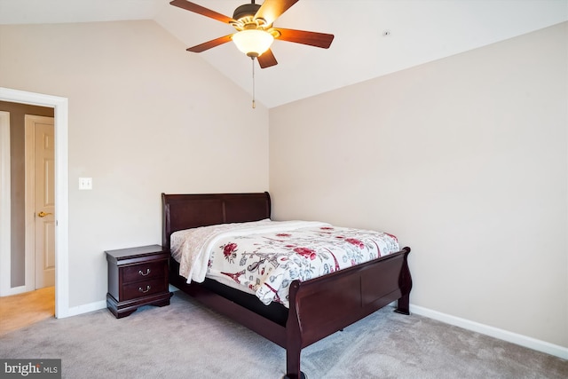 bedroom featuring ceiling fan, light carpet, and vaulted ceiling