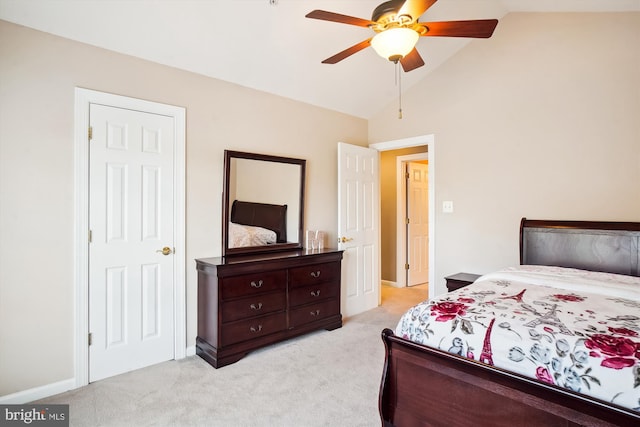 bedroom with light carpet, high vaulted ceiling, and ceiling fan