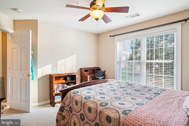 bedroom featuring light carpet and ceiling fan