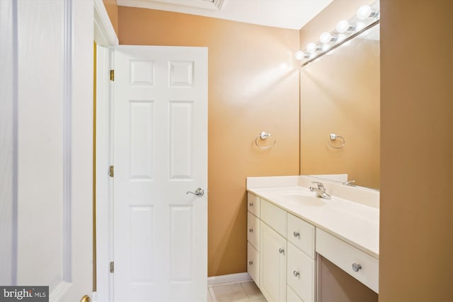 bathroom with tile flooring and vanity