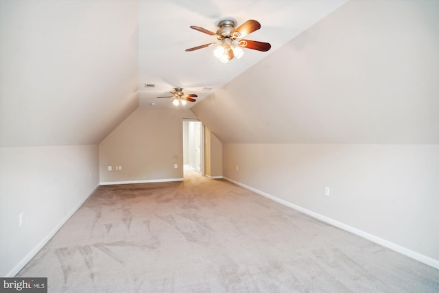 bonus room with light carpet, ceiling fan, and vaulted ceiling