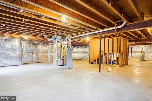 basement featuring water heater and heating utilities