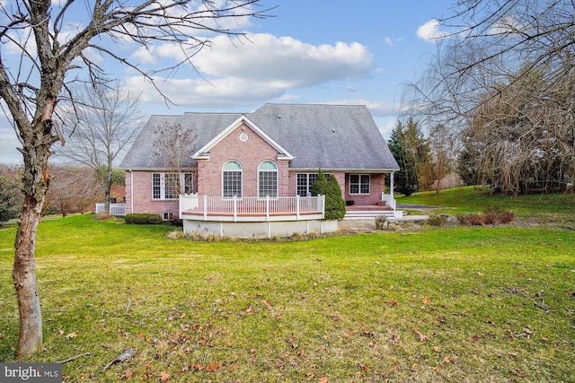 back of house with a lawn