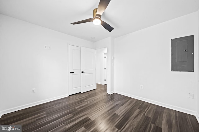 spare room featuring ceiling fan and dark hardwood / wood-style flooring