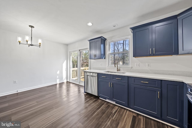 kitchen featuring dark wood-type flooring, dishwasher, sink, a chandelier, and blue cabinets