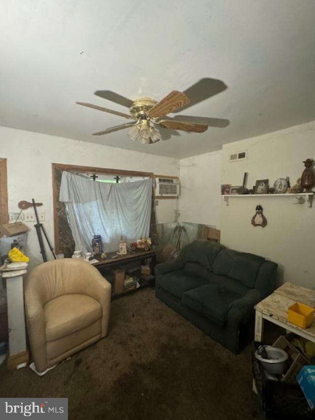 carpeted living room featuring an AC wall unit