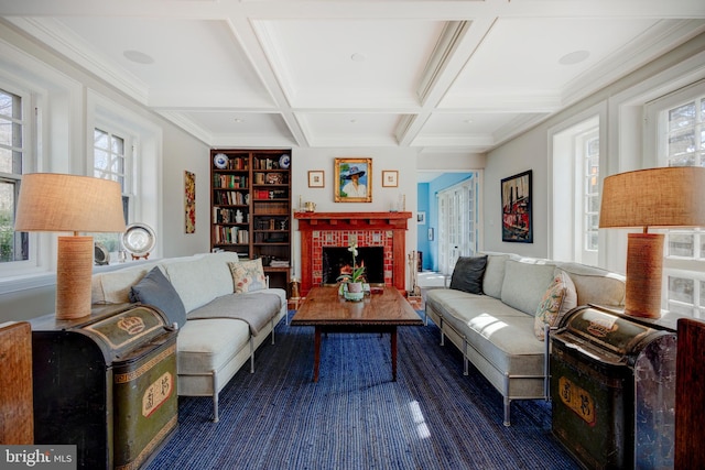 living room with coffered ceiling, beamed ceiling, a fireplace, and a wealth of natural light