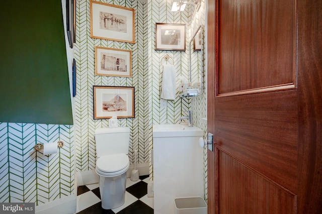 bathroom with vanity, tile floors, and toilet