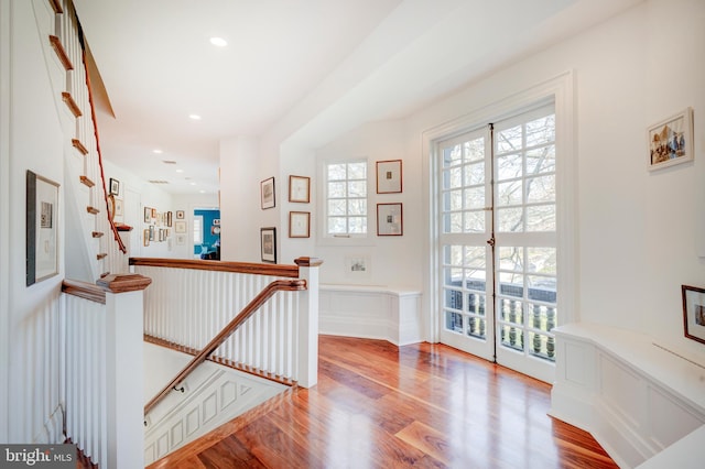 hall with light hardwood / wood-style floors