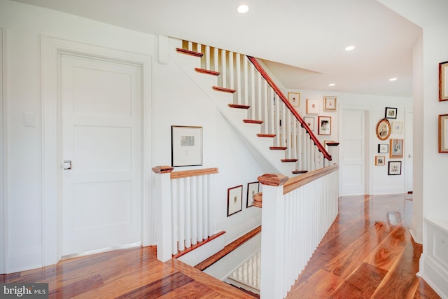 stairway featuring light hardwood / wood-style flooring