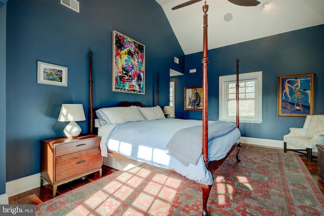 bedroom featuring ceiling fan, dark wood-type flooring, and high vaulted ceiling