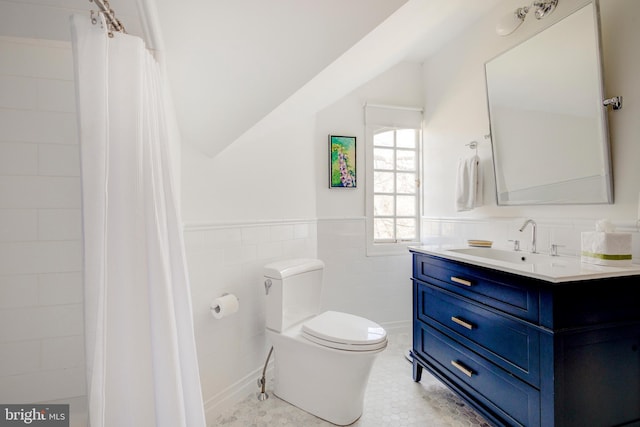 bathroom with tile flooring, tile walls, tasteful backsplash, toilet, and vanity