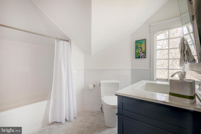 full bathroom featuring tile walls, shower / bathtub combination with curtain, vaulted ceiling, toilet, and oversized vanity