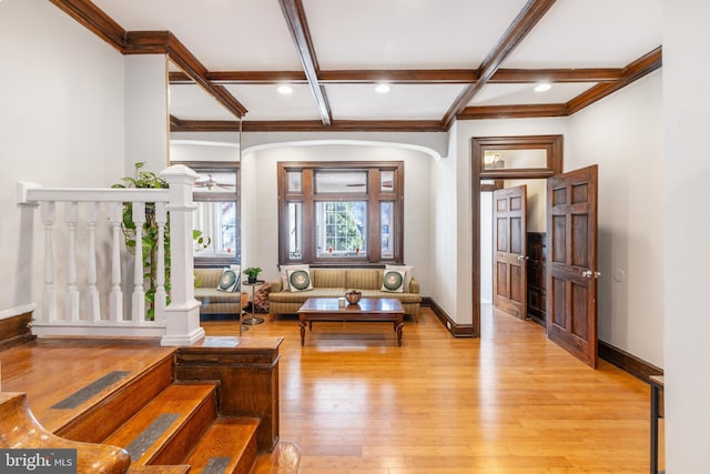 living room featuring beam ceiling, light wood-type flooring, and coffered ceiling