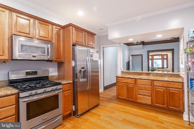 kitchen featuring light stone countertops, crown molding, light wood-type flooring, and stainless steel appliances