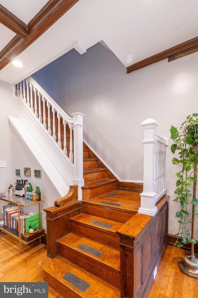 staircase featuring light wood-type flooring