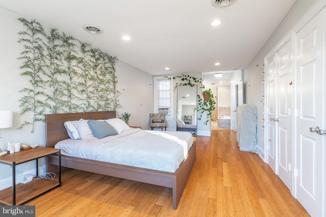 bedroom featuring light hardwood / wood-style floors