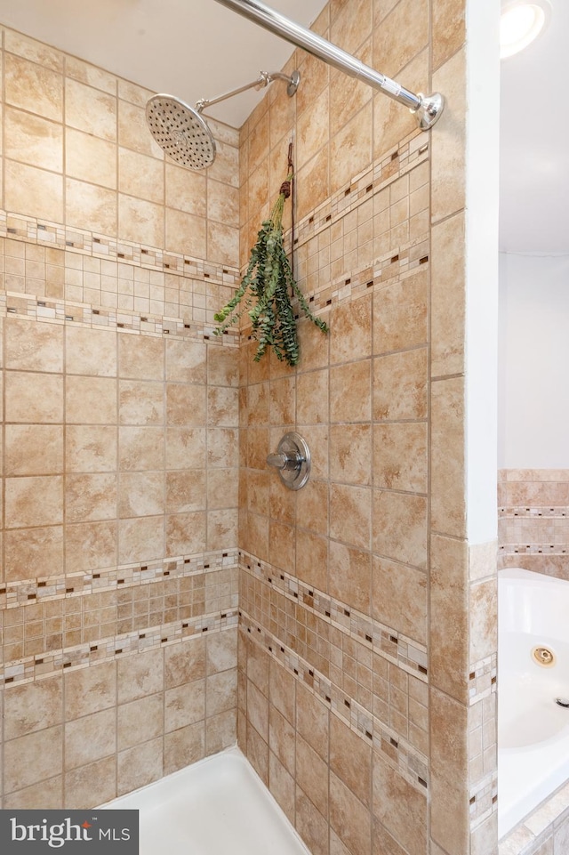 bathroom with a tile shower