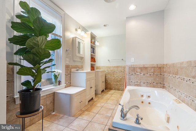 bathroom with tile walls, tile flooring, and vanity