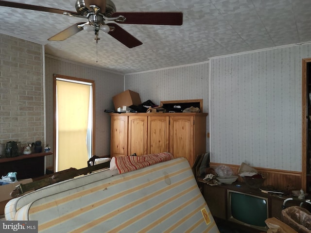 bedroom featuring ceiling fan and ornamental molding