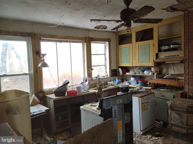 kitchen with plenty of natural light and ceiling fan