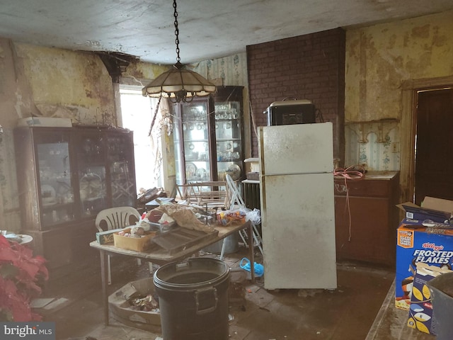 dining area with brick wall