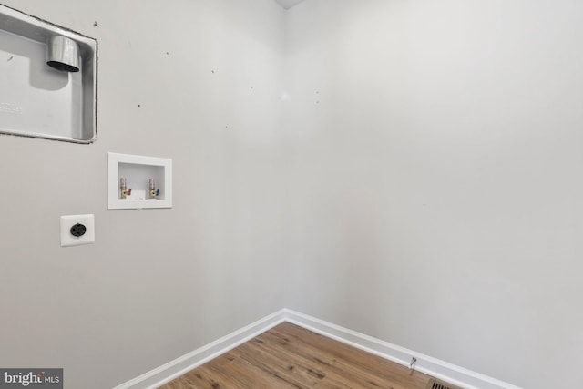 washroom featuring hookup for an electric dryer, wood-type flooring, and hookup for a washing machine