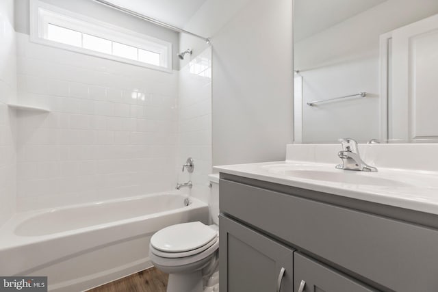 full bathroom featuring vanity, shower / tub combination, wood-type flooring, and toilet