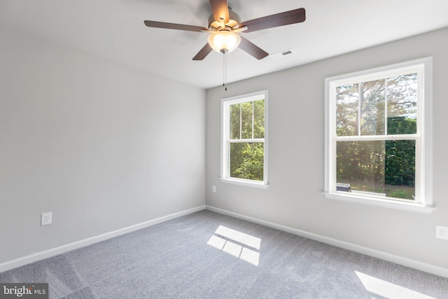 carpeted empty room with ceiling fan