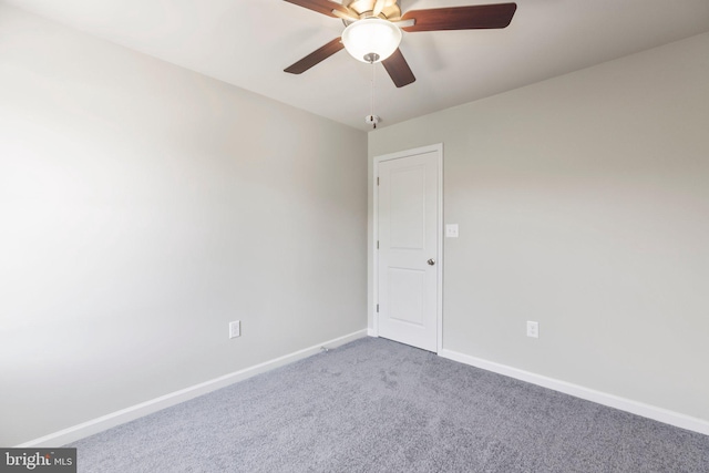 empty room with ceiling fan and light colored carpet