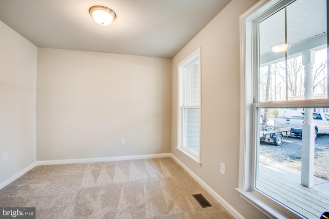 empty room with light colored carpet