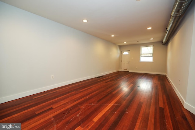 empty room with hardwood / wood-style floors