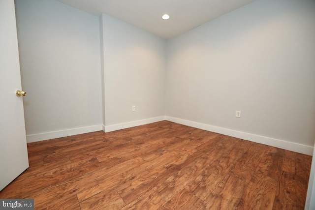 empty room featuring dark hardwood / wood-style flooring